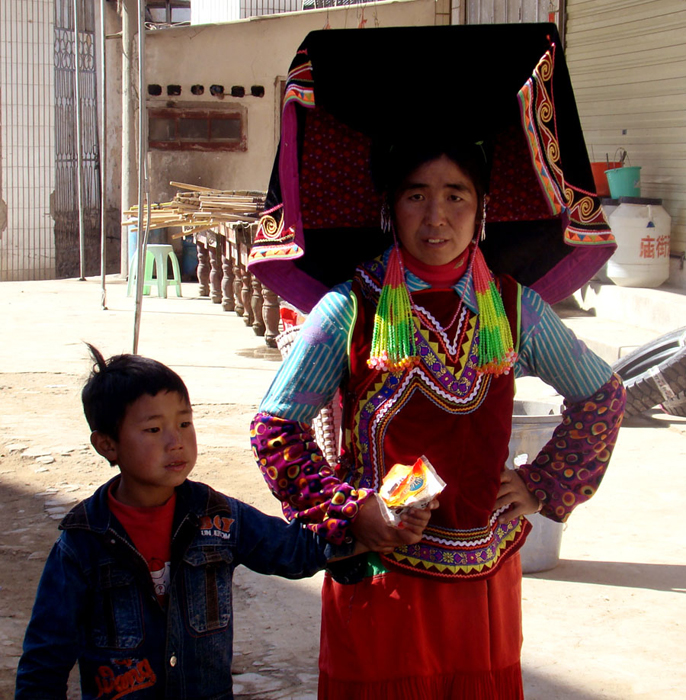 ethnic yi woman with her son